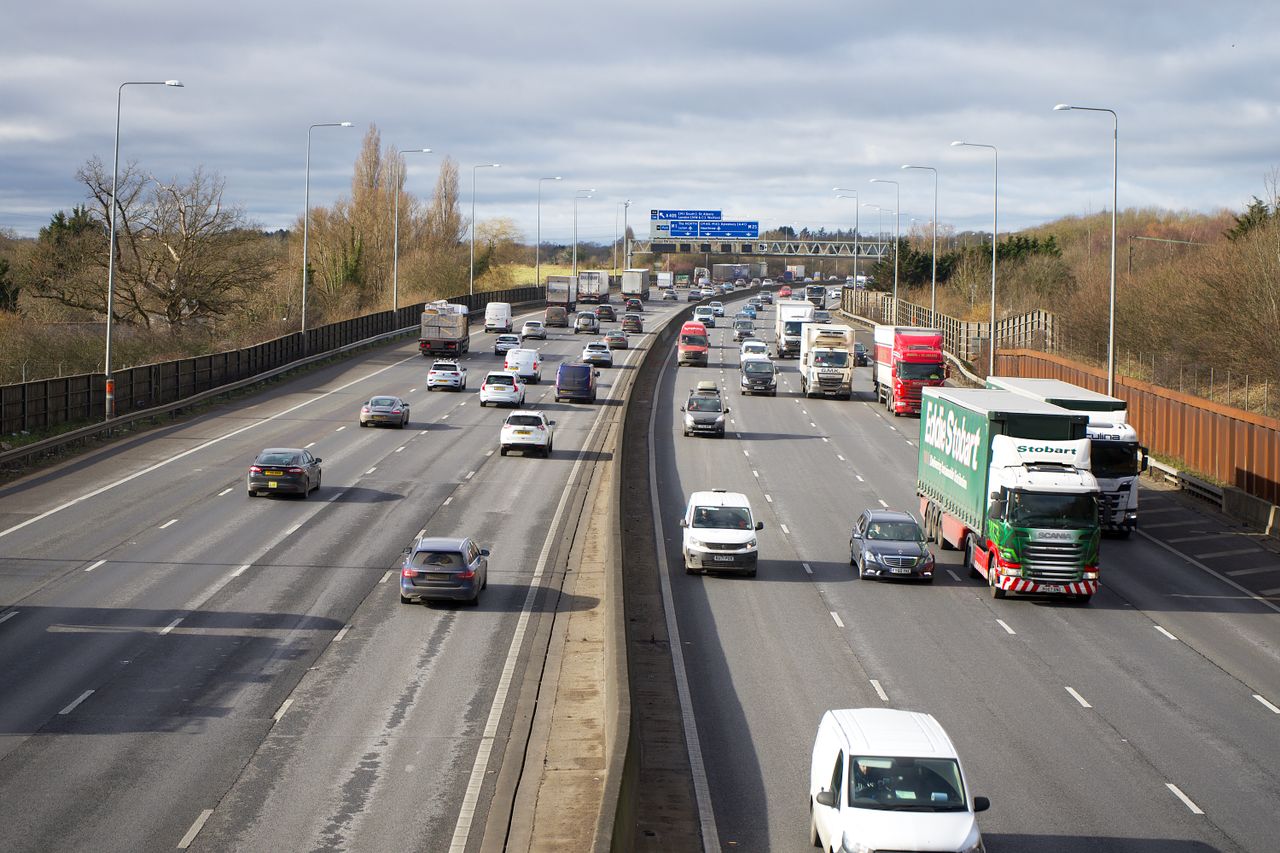 About A dynamic view of cars and trucks on a busy motorway in St Albans, England.